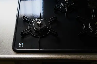 a close up of a black stove top with two burners at Direct Haneda Access &Onsen 1-min Walk SAMURAI STAY ZEN in Tokyo