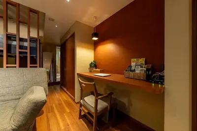 a room with a counter with a chair and a desk at \u65c5\u9928\u87a2 in Tokyo