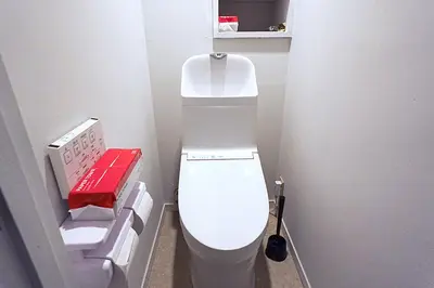 a small bathroom with a white toilet in a room at HOSTEL EstLiLas KANDA \u30a2\u30cd\u30c3\u30af\u30b9 in Tokyo