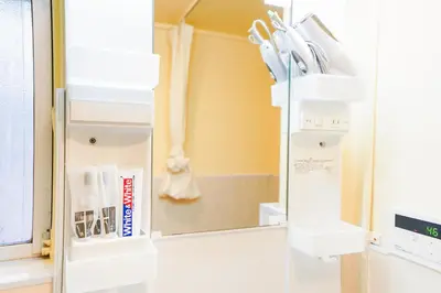 a refrigerator with a mirror in a room at 302Room 1 Stop from Ikebukuro Entire 33m on 3st Floor 2 Bedrooms for up to 6 Guests 3Minute Walk to Don Quijote in Tokyo