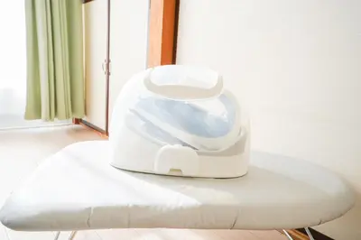 a white appliance sitting on a table next to a window at 302Room 1 Stop from Ikebukuro Entire 33m on 3st Floor 2 Bedrooms for up to 6 Guests 3Minute Walk to Don Quijote in Tokyo