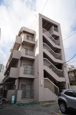 a tall building with stairs on the side of it at 302Room 1 Stop from Ikebukuro Entire 33m on 3st Floor 2 Bedrooms for up to 6 Guests 3Minute Walk to Don Quijote in Tokyo