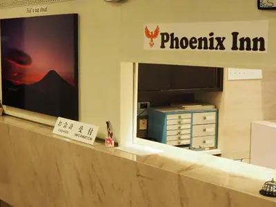 a photograph of a photography firm sign in a store window at Phoenix Inn in Tokyo