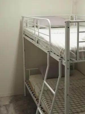 a couple of bunk beds in a room at Phoenix Inn in Tokyo