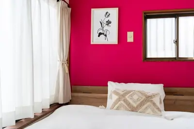a bedroom with a pink wall and a bed at TokyoDisneyAkihabara,Entire House,8Ppl,5Bedl60m2 in Tokyo