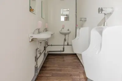 a bathroom with three sinks and two urinals at Akabane Dormitory \u8d64\u7fbd\u30c9\u30df\u30c8\u30ea\u30fc - Share Room For Male Only \u7537\u6027\u5c02\u7528\u30c9\u30df\u30c8\u30ea\u30fc in Tokyo