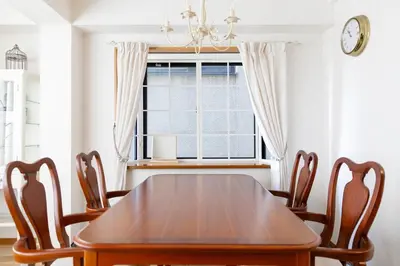 a dining room with a wooden table and chairs at New - 4 min to Shinjuku! 4 Bedrooms Villa 970 sq ft in Koenji, 10 people, 8 min walk to JR Koenji station - GRADIA Koenji Hotel in Tokyo