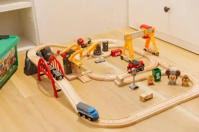 a toy train track with toy cars and trucks at New - 4 min to Shinjuku! 4 Bedrooms Villa 970 sq ft in Koenji, 10 people, 8 min walk to JR Koenji station - GRADIA Koenji Hotel in Tokyo