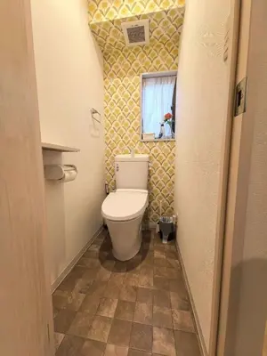 a small bathroom with a toilet and a window at AYA House in Tokyo