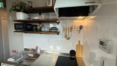 a kitchen with a sink and a counter top at SW House in Tokyo