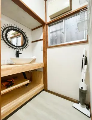 a bathroom with a sink and a mirror at gjbbkoiwa in Tokyo