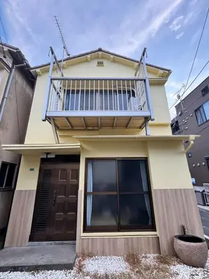 a house with a balcony on top of it at Akihabara, Skytree, Disney, Asakusa Temple, Traditional Japanese Ryokan, Airport Pick-up and Drop-off in Tokyo