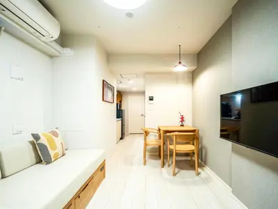 a room with a table and a dining room at Section L Akihabara in Tokyo