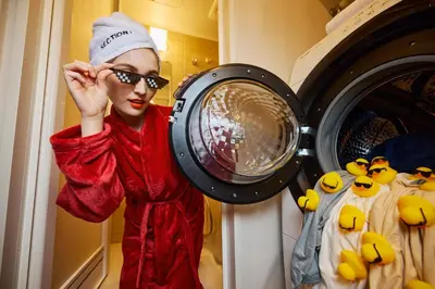 a woman is standing next to a washing machine at Section L Akihabara in Tokyo