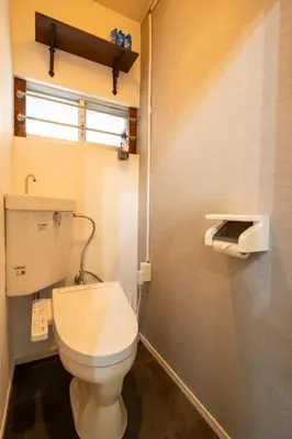 a bathroom with a white toilet and a window at #34-Zen Home- \u6771\u745e\u6c5f in Tokyo