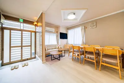 a living room with a dining room table and chairs at #34-Zen Home- \u6771\u745e\u6c5f in Tokyo