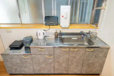 a kitchen counter with a sink and a appliance at #34-Zen Home- \u6771\u745e\u6c5f in Tokyo
