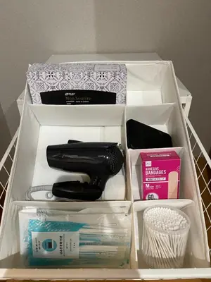 a drawer with a hairbrush and other items in it at #6 WiFi無料&新宿5分! 清潔 安全 お洒落な部屋! in Tokyo