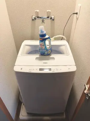 a blue bottle of detergent sitting on top of a sink at #6 WiFi無料&新宿5分! 清潔 安全 お洒落な部屋! in Tokyo