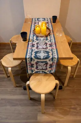 a wooden table with a table cloth on it with two chairs at #6 WiFi無料&新宿5分! 清潔 安全 お洒落な部屋! in Tokyo