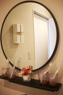 a mirror on a shelf in a bathroom at \u53f0\u6771\u533a\u30a2\u30d1\u30fc\u30c8\u30e1\u30f3\u30c8 in Tokyo