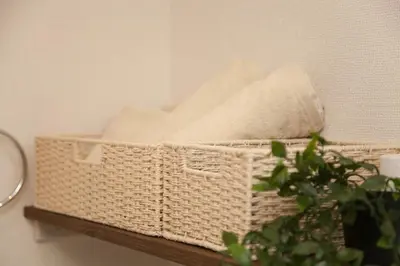 a wicker basket sitting on a shelf with a plant at Imb\u753a\u5c4b4\u4e01\u76ee102 in Tokyo