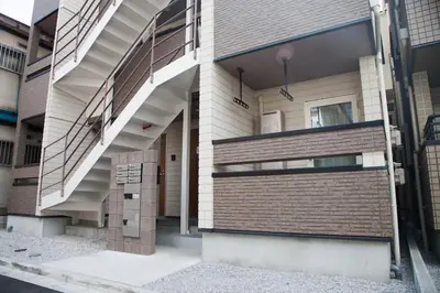 a building with a staircase on the side of it at Imb\u753a\u5c4b4\u4e01\u76ee102 in Tokyo