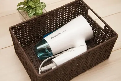 a wicker basket with a hair dryer in it at Imb\u753a\u5c4b4\u4e01\u76ee102 in Tokyo