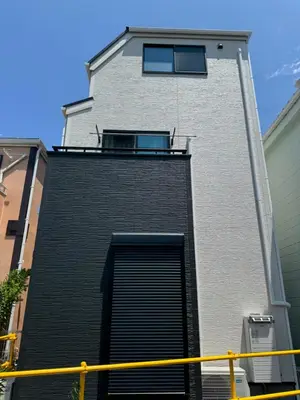 a building with a door and a window on it at HB Home TOKYO in Tokyo