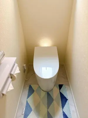 a bathroom with a white toilet and a sink at HB Home TOKYO in Tokyo