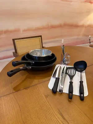 a table with a bowl and utensils on it at 52 House Shimbashi in Tokyo