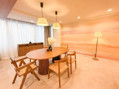 a dining room with a wooden table and chairs at 52 House Shimbashi in Tokyo