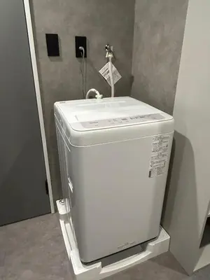 a bathroom with a sink on top of a toilet at Domo Stay in Tokyo