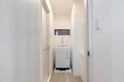 a small white bathroom with a sink in a room at -Imado- Within walking distance of Asakusa Station and Tokyo Skytree! in Tokyo
