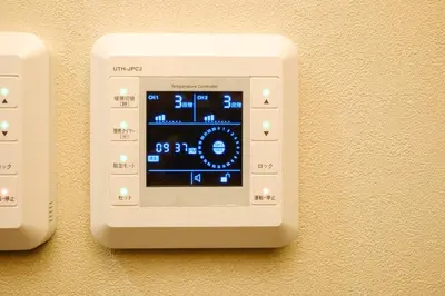 an electronic device is attached to a wall at Yolo Asakusa Stay in Tokyo