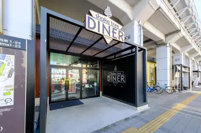a building with a sign that reads inside the diner at Yolo Asakusa Stay in Tokyo