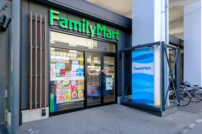 a familymart store with a sign on the front of it at Yolo Asakusa Stay in Tokyo