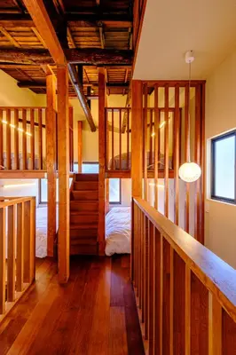 a room with a staircase and a bed in it at Yolo Asakusa Stay in Tokyo