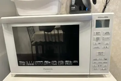 a microwave oven with a chair inside of it at Newly Renovated & Yamanote Line Sugamo 7 Minute Walk in Tokyo