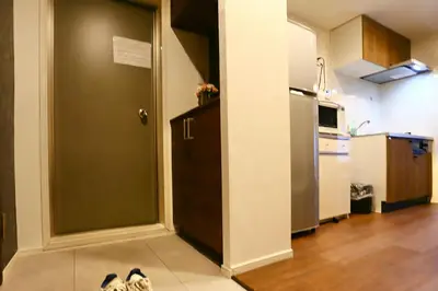 an open door to a kitchen with a refrigerator at Newly Renovated & Yamanote Line Sugamo 7 Minute Walk in Tokyo