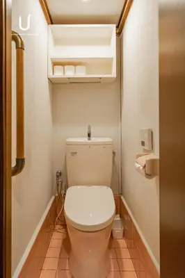 a bathroom with a toilet in a room at unito villa SHINJUKU in Tokyo