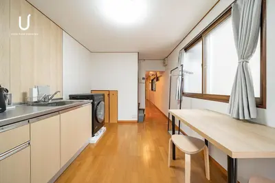 a kitchen with a sink and a counter top at unito villa SHINJUKU in Tokyo