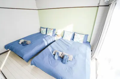 two beds with stuffed elephants on them in a room at 402Room 1 Stop from Ikebukuro Entire 35m on 4st Floor 2 Bedrooms for up to 6 Guests 3Minute Walk to Don Quijote in Tokyo