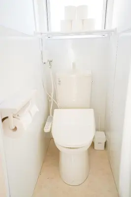 a white bathroom with a toilet and a sink at 403Room 1 Stop from Ikebukuro Entire 35m on 4st Floor 2 Bedrooms for up to 6 Guests 3Minute Walk to Don Quijote in Tokyo