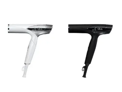 two black and white toothbrushes on a white background at HOTEL LiVEMAX Higashi Ginza in Tokyo