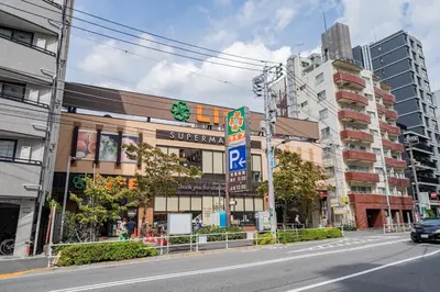 a street in a city with a building at unito residence SHINJUKU Wakamatsu in Tokyo