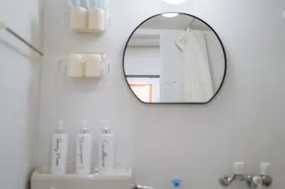 a bathroom with a mirror and a sink at \u6771\u65b0\u5bbf-Shinjuku Area-Max3P-Vintage Style-St 3mins in Tokyo