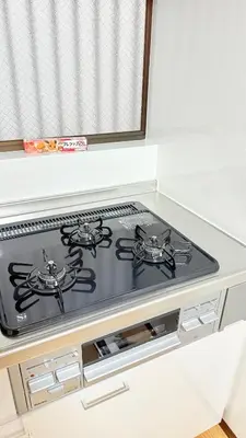 a stove top oven sitting inside of a kitchen at Higashi-Jujo-house \u7950\u6cfd KI0478 in Tokyo
