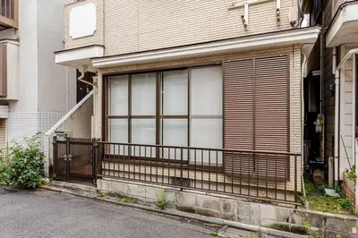 a house with a large window with a fence at Nnb\u938c\u50094\u4e01\u76ee in Tokyo