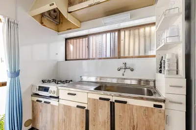 a kitchen with a sink and a stove at Nnb\u938c\u50094\u4e01\u76ee in Tokyo